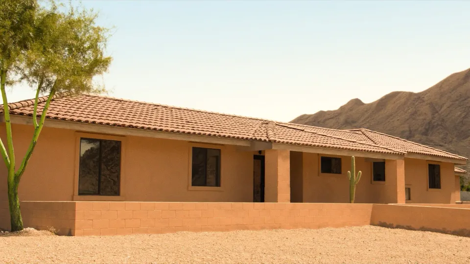 Single-story stucco home with a tile roof on a desert lot in Maricopa County, Arizona